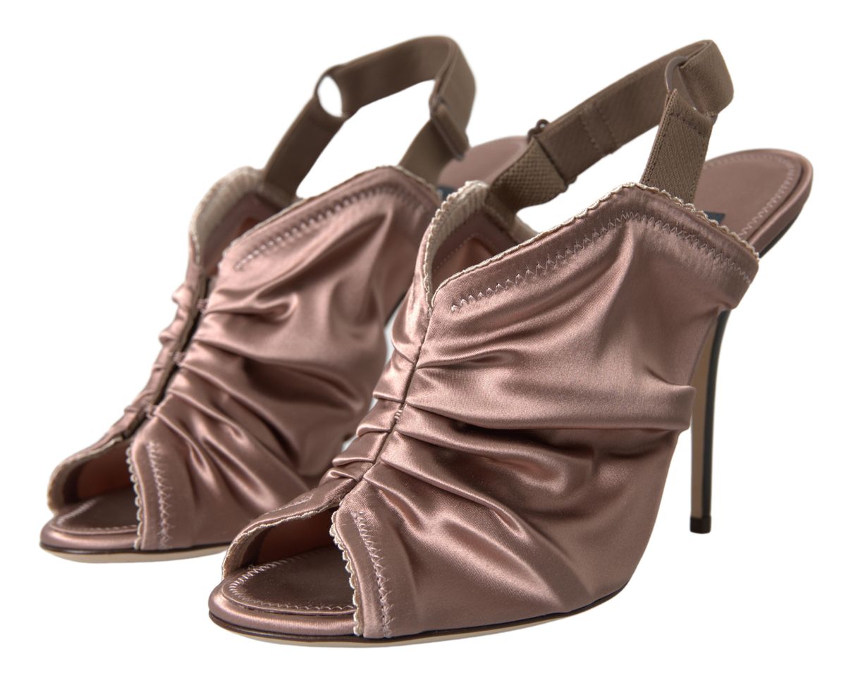 Pair of high heel shoes with ruffled straps and a stiletto heel