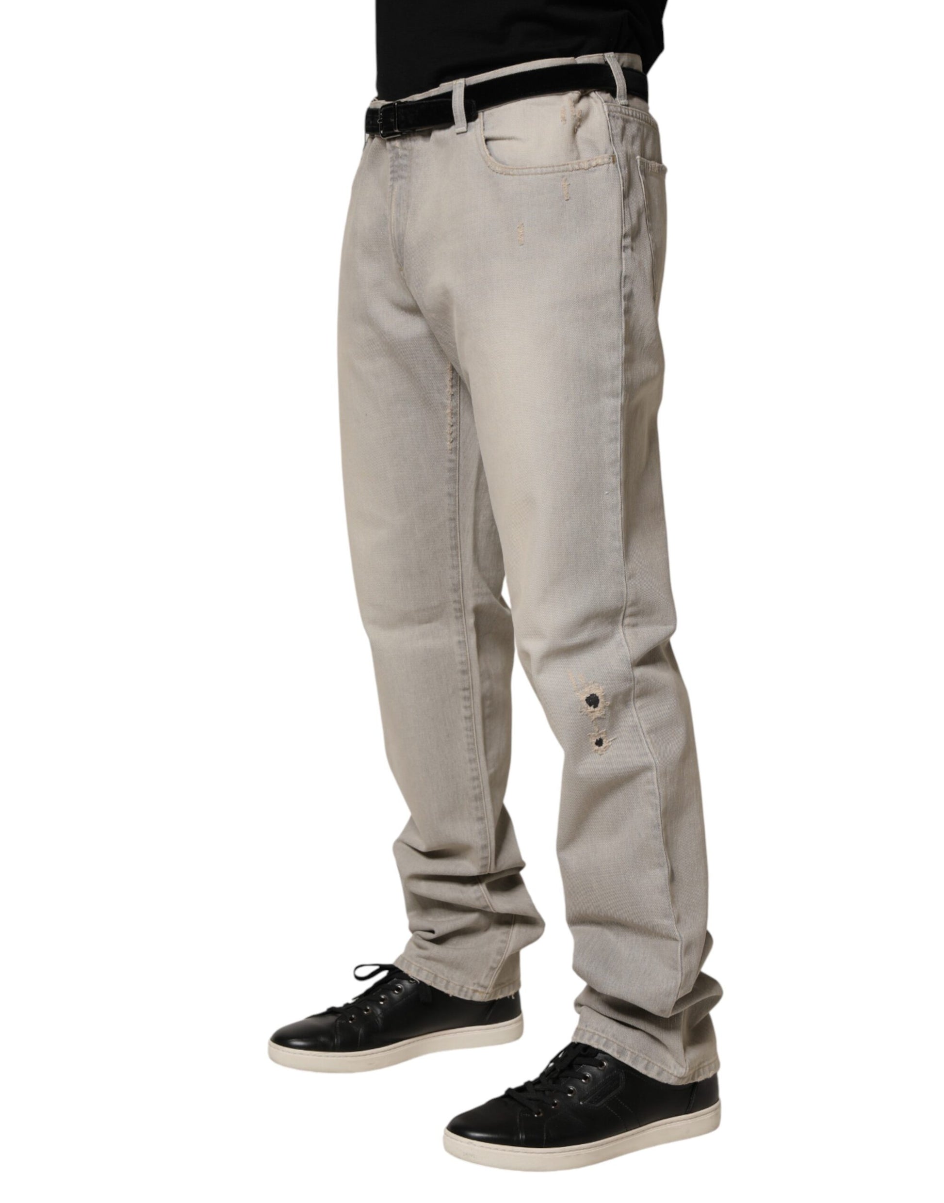 Man wearing jeans and sneakers