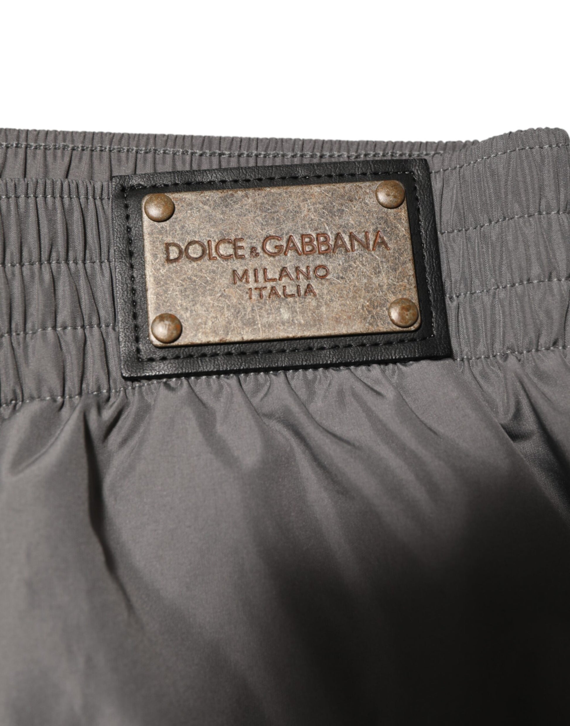 The tag on a pair of pants reads "Dolce & Gabbana"
