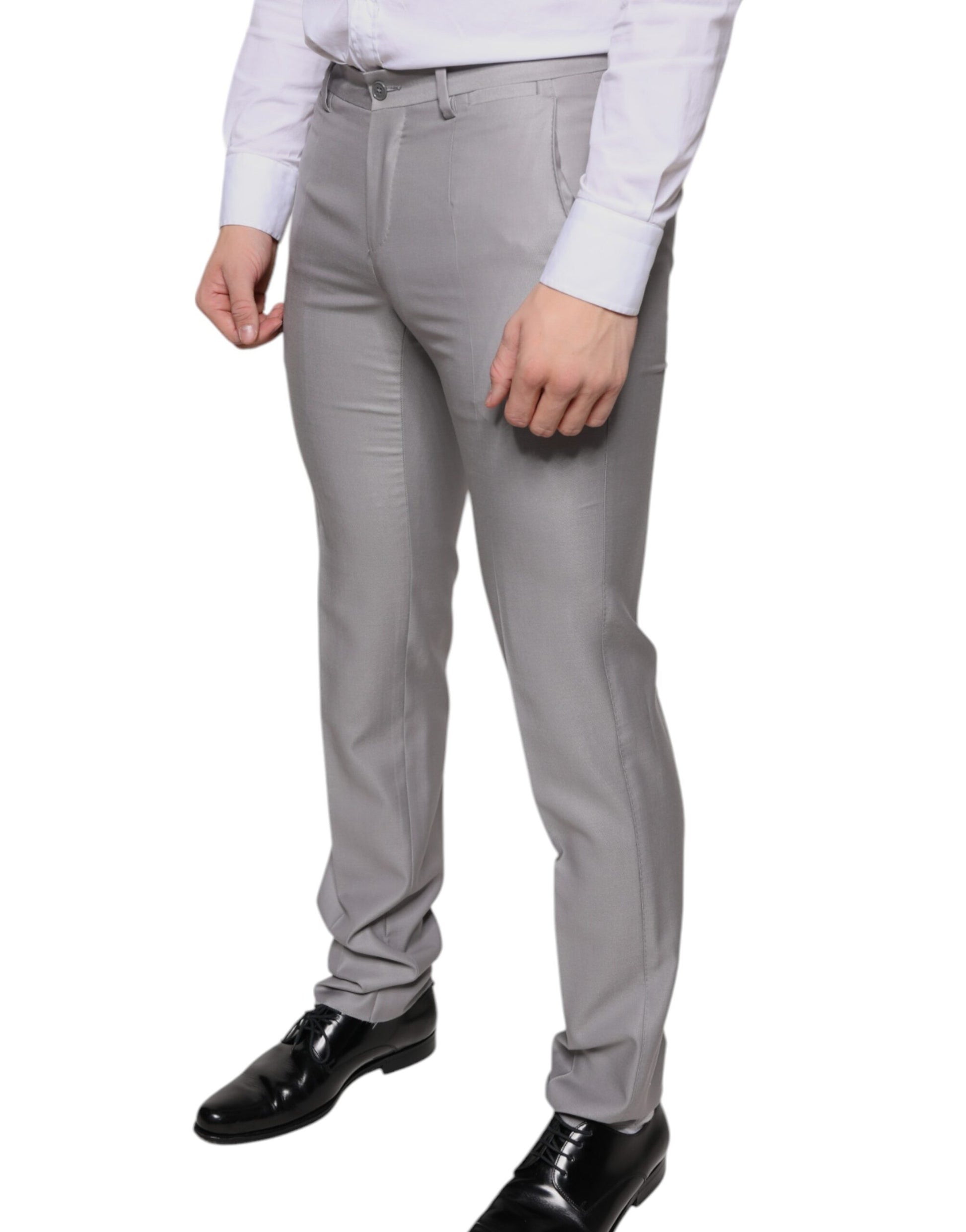 Men's light gray wool dress pants with a slim fit and black shoes