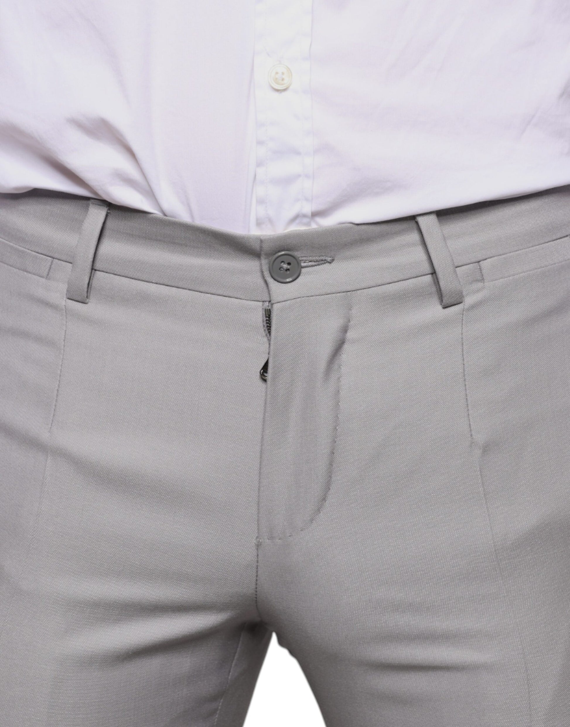 A pair of light gray wool dress pants with a button and belt loops, designed by Dolce & Gabbana