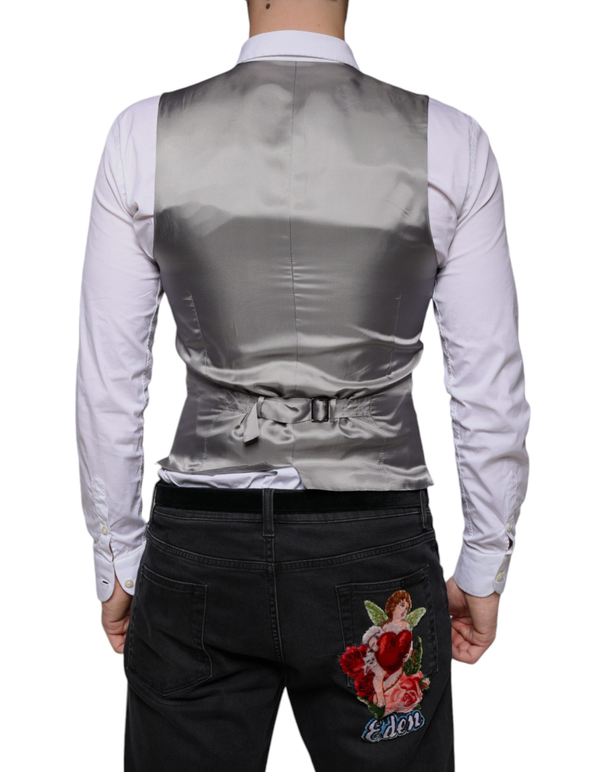 A light gray wool vest with a lapel and tie, part of a formal dress ensemble