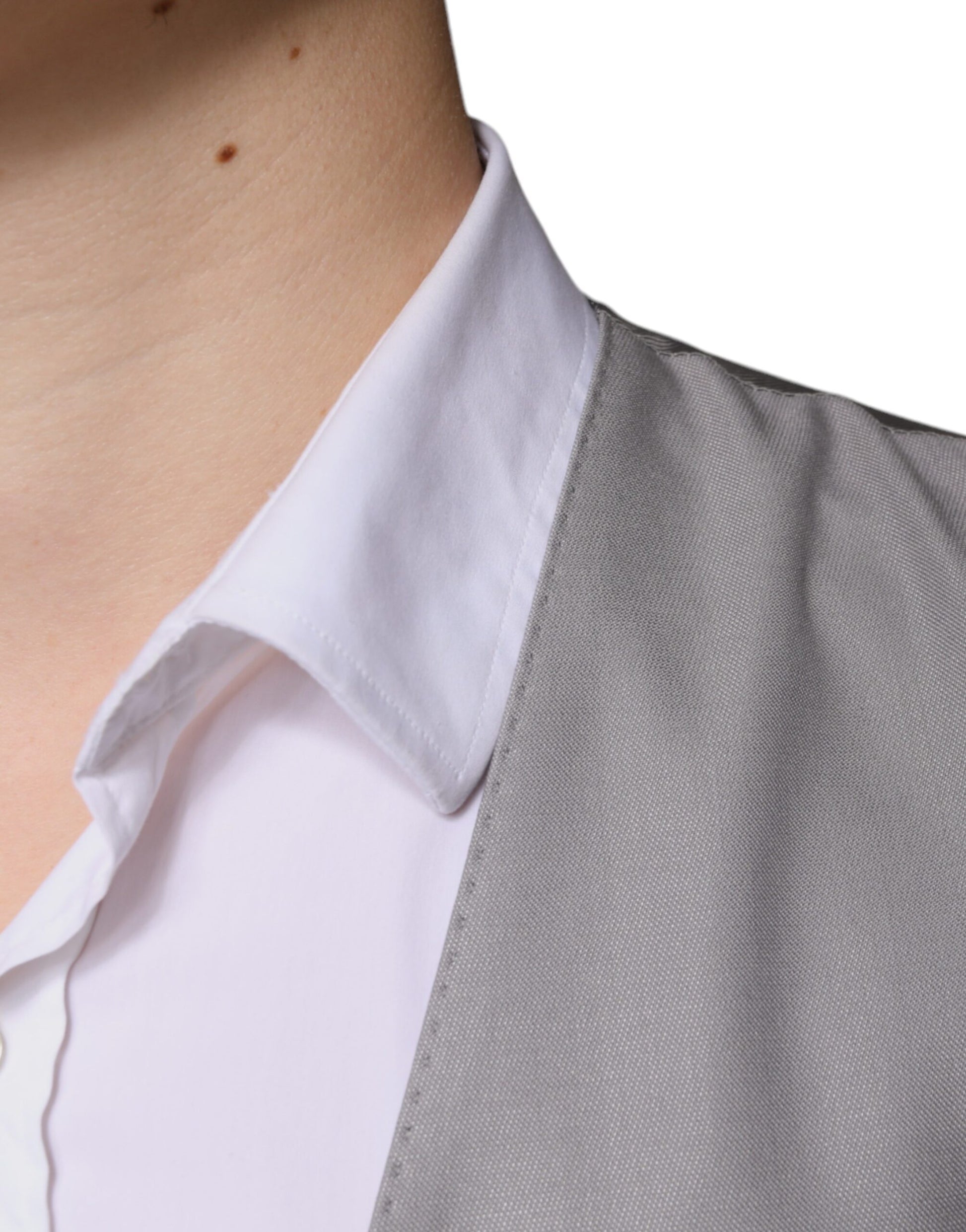 A light gray wool vest with a notched collar, worn by a mannequin