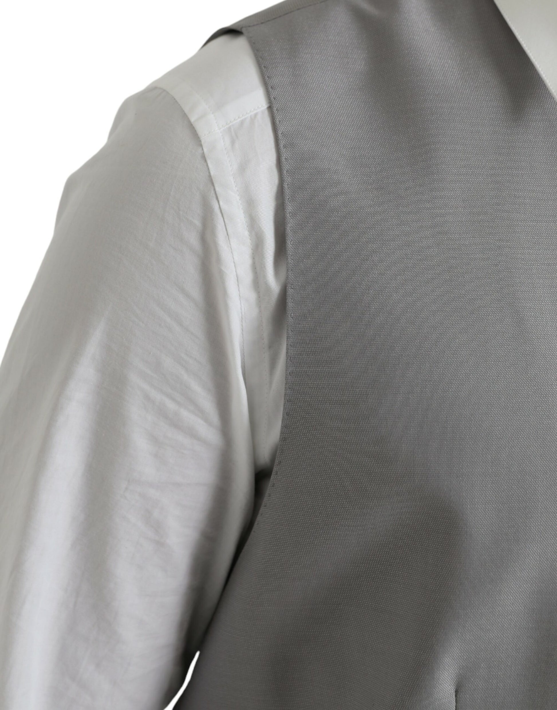 A light gray wool vest with a textured pattern, part of a formal dress ensemble