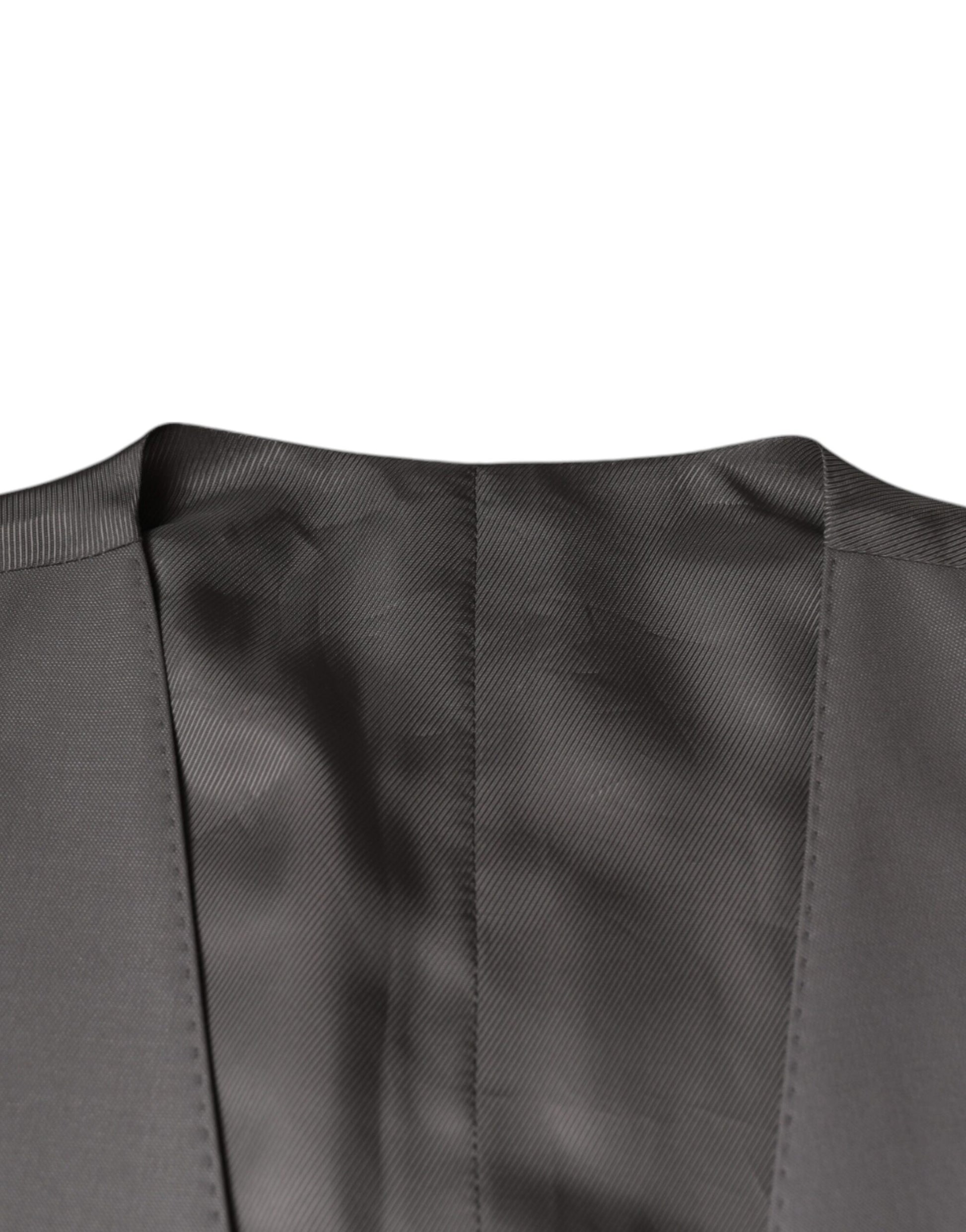 A black wool vest with a ribbed texture and a high neckline