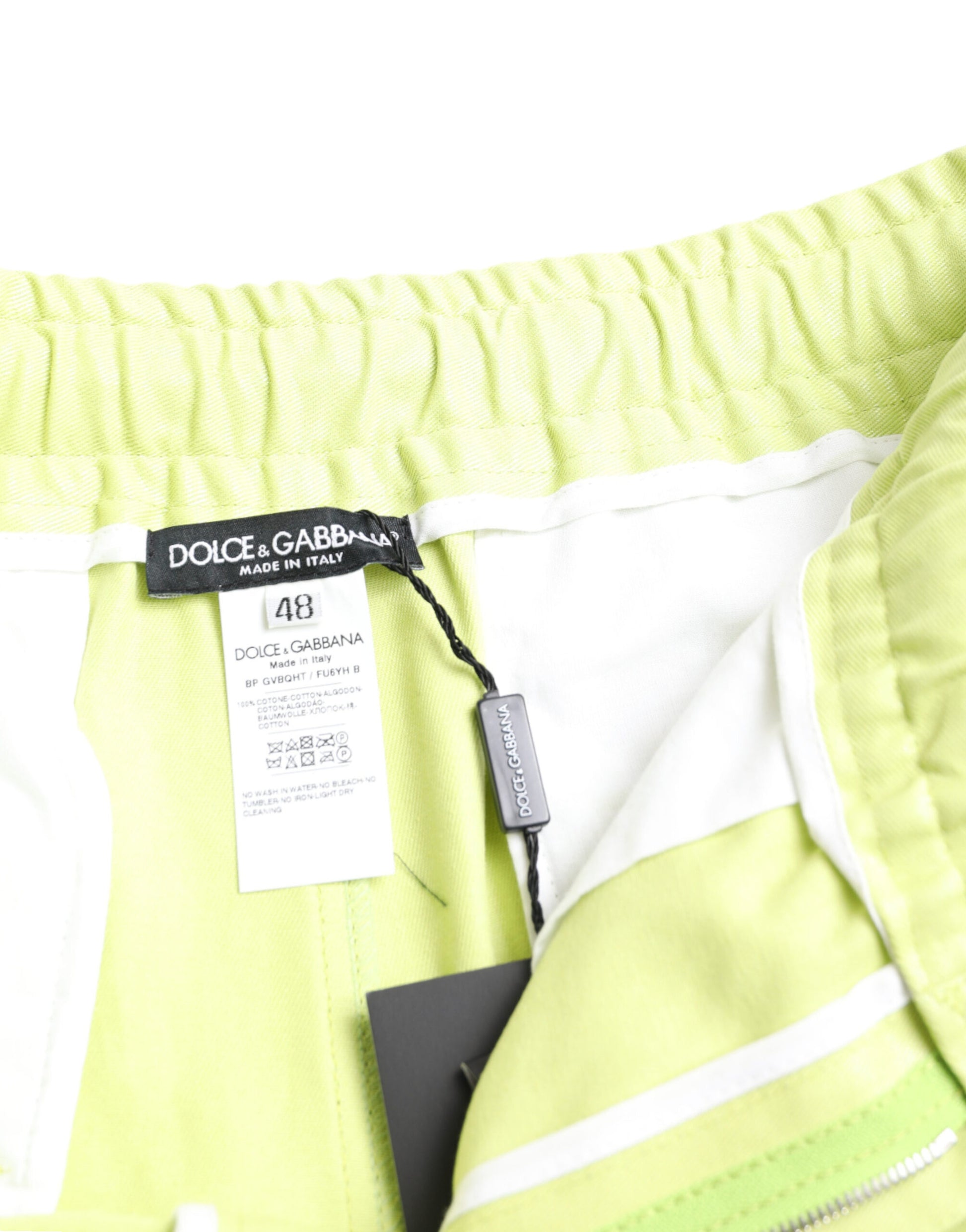 Yellow and white striped shorts with black label
