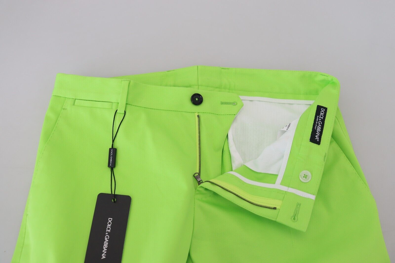 Bright yellow pants with black tag