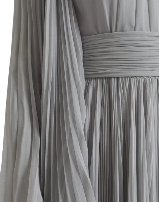 A long grey dress with pleats, designed by Dolce & Gabbana