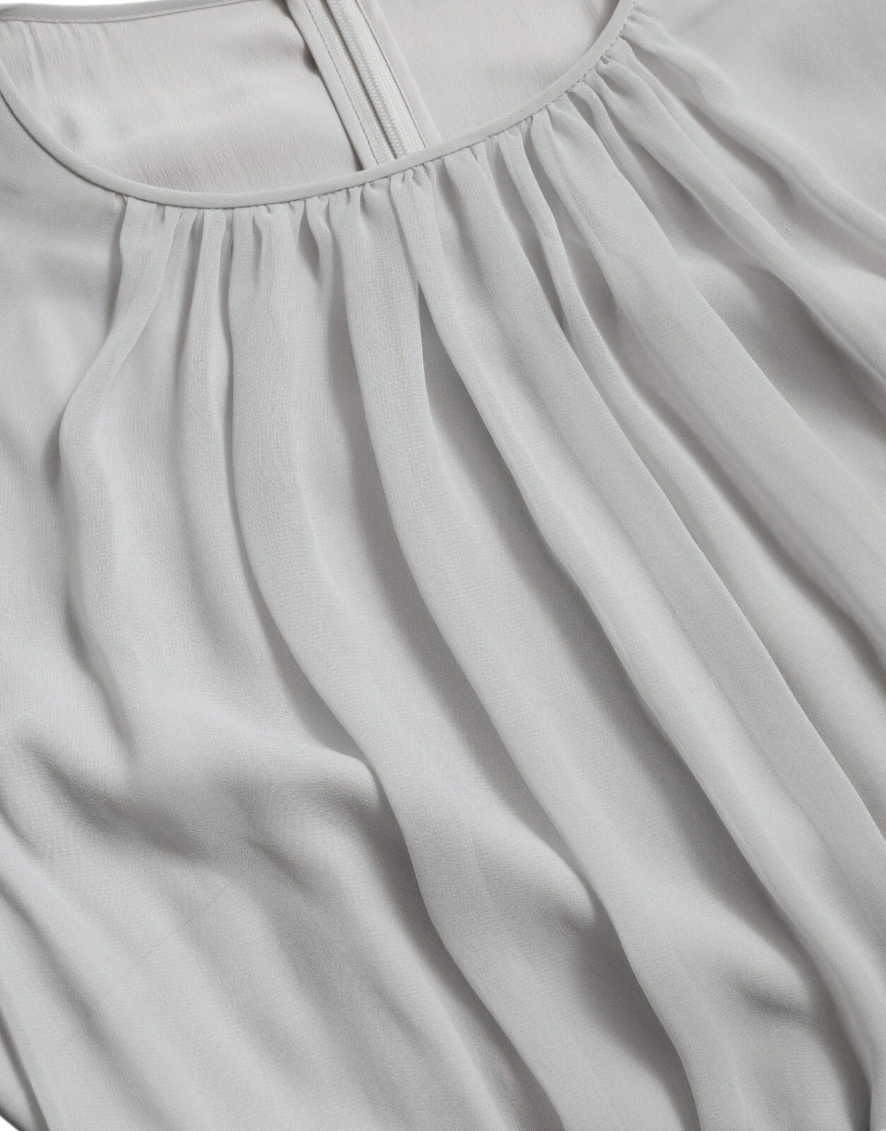 A light grey pleated maxi dress with a V-neckline and short sleeves