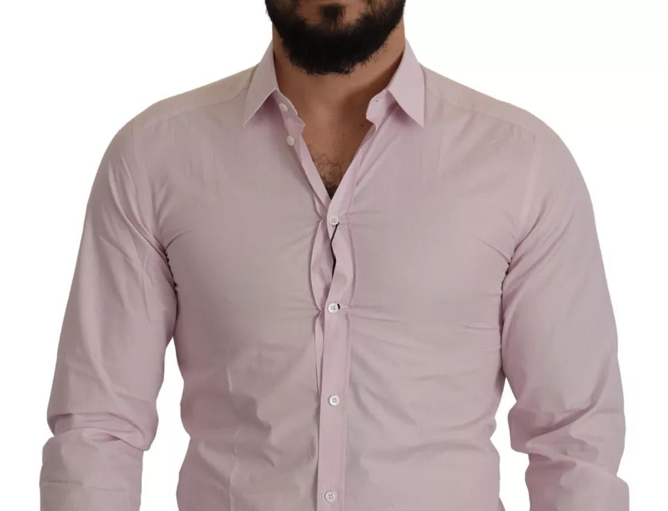 A light pink cotton dress shirt with a gold button and collar