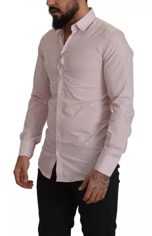 A light pink cotton dress shirt with a collar and button-up front