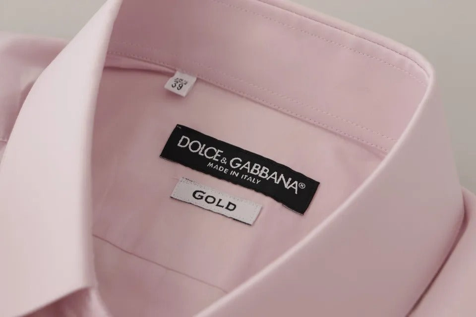 A light pink cotton dress shirt with a gold label from Dolce & Gabbana