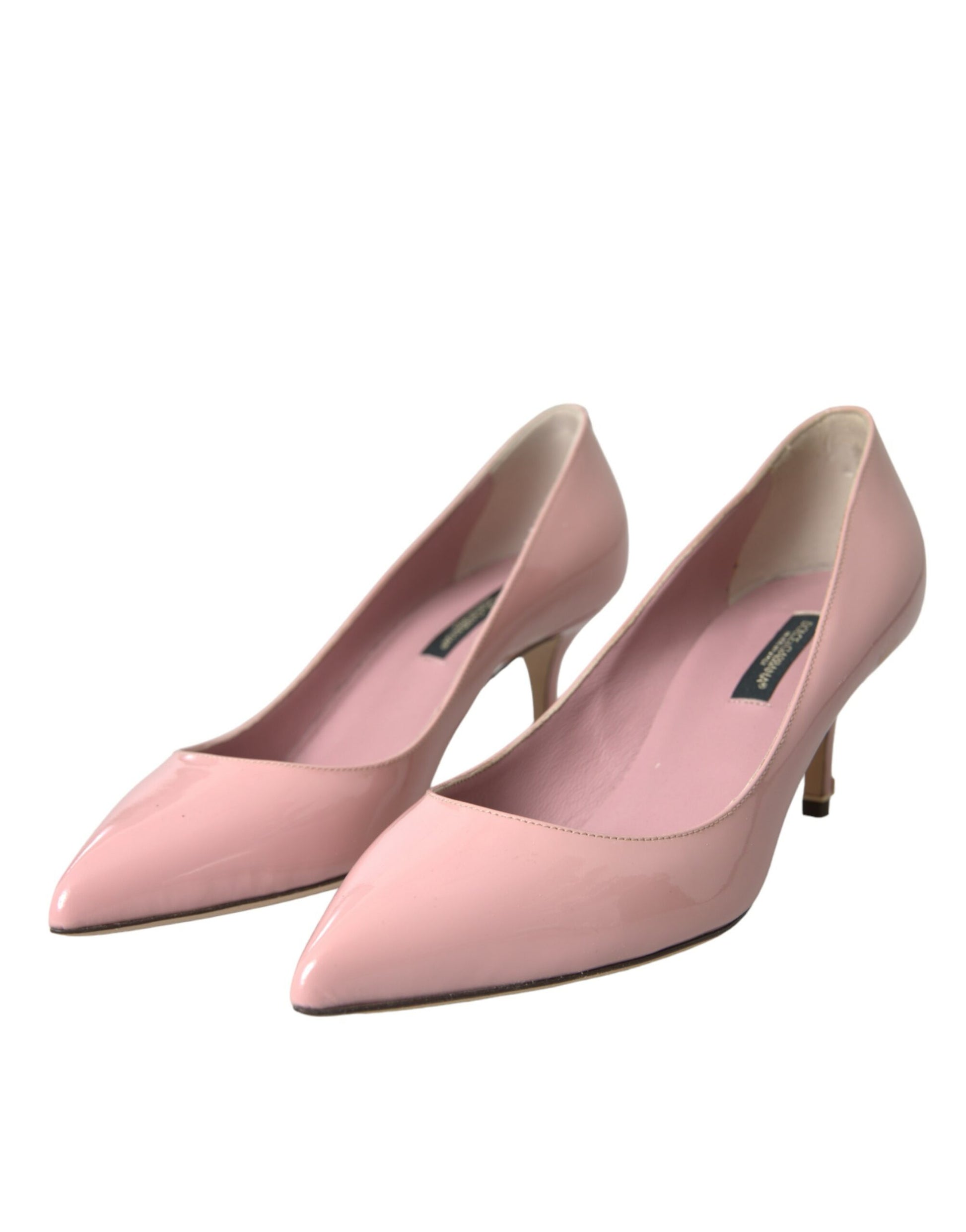 Pair of pink women's dress shoes with heels and pointed toes