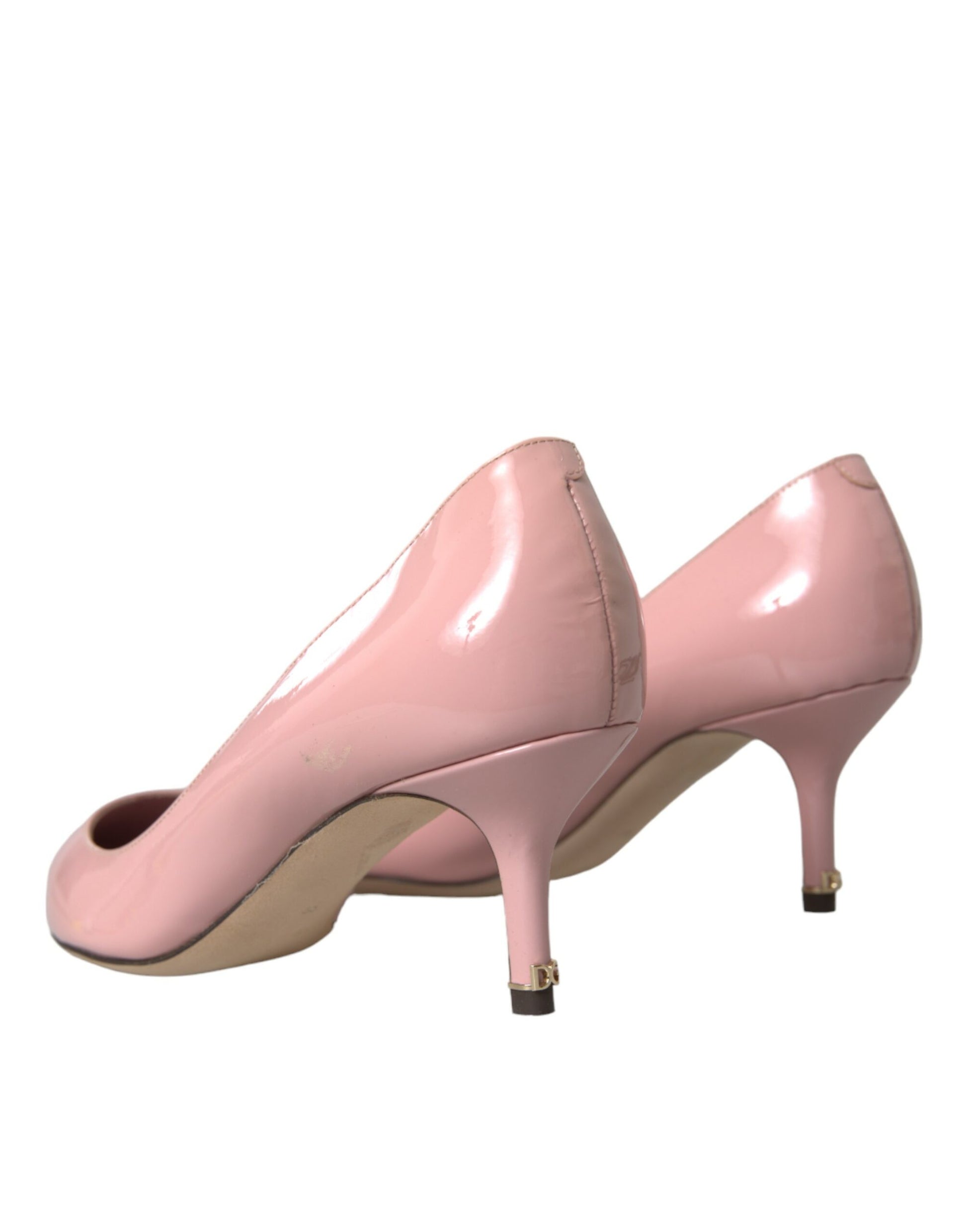 Pair of pink high heel shoes with pointed toe and stiletto heels