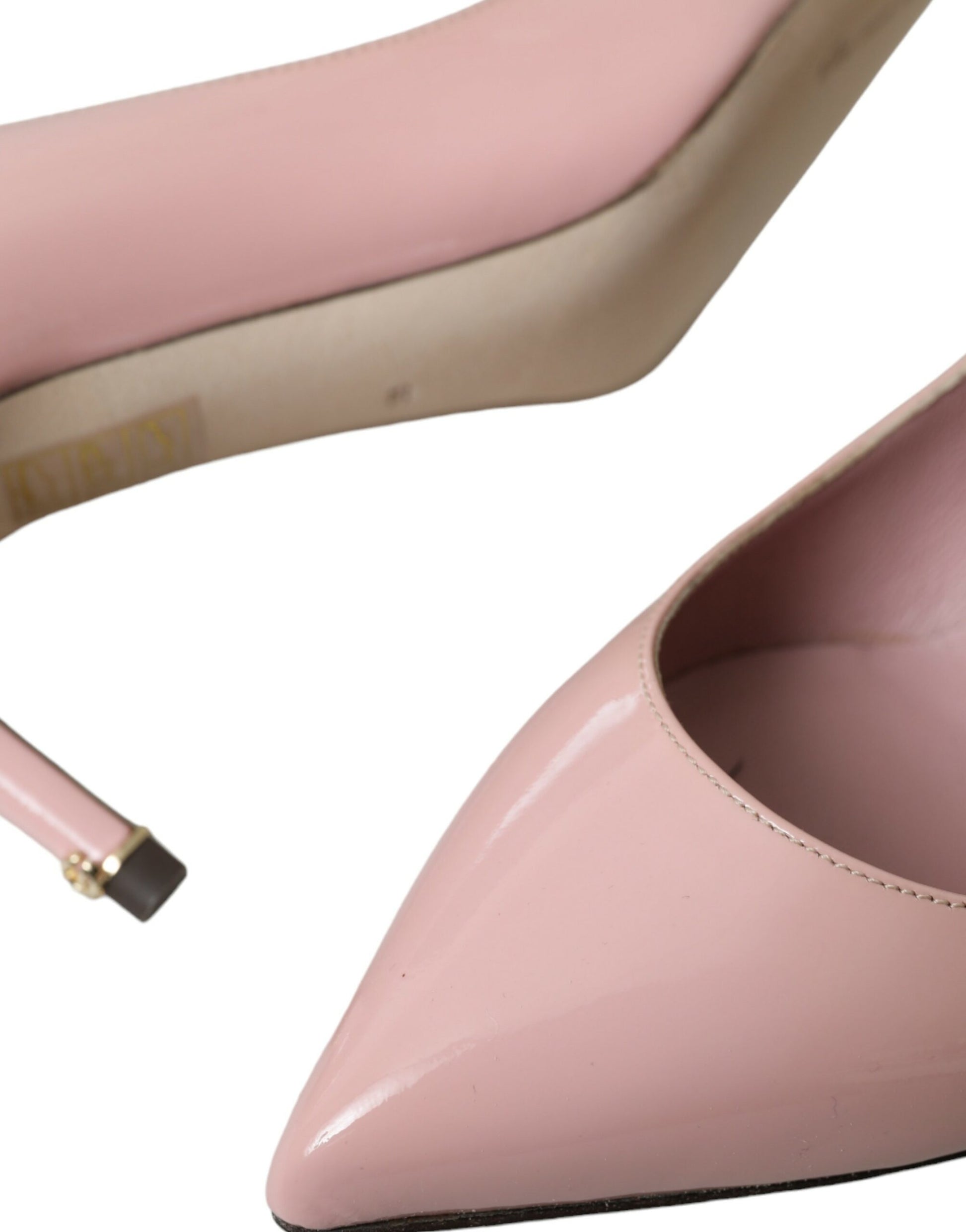 Pink high heel shoe with open toe and ankle strap