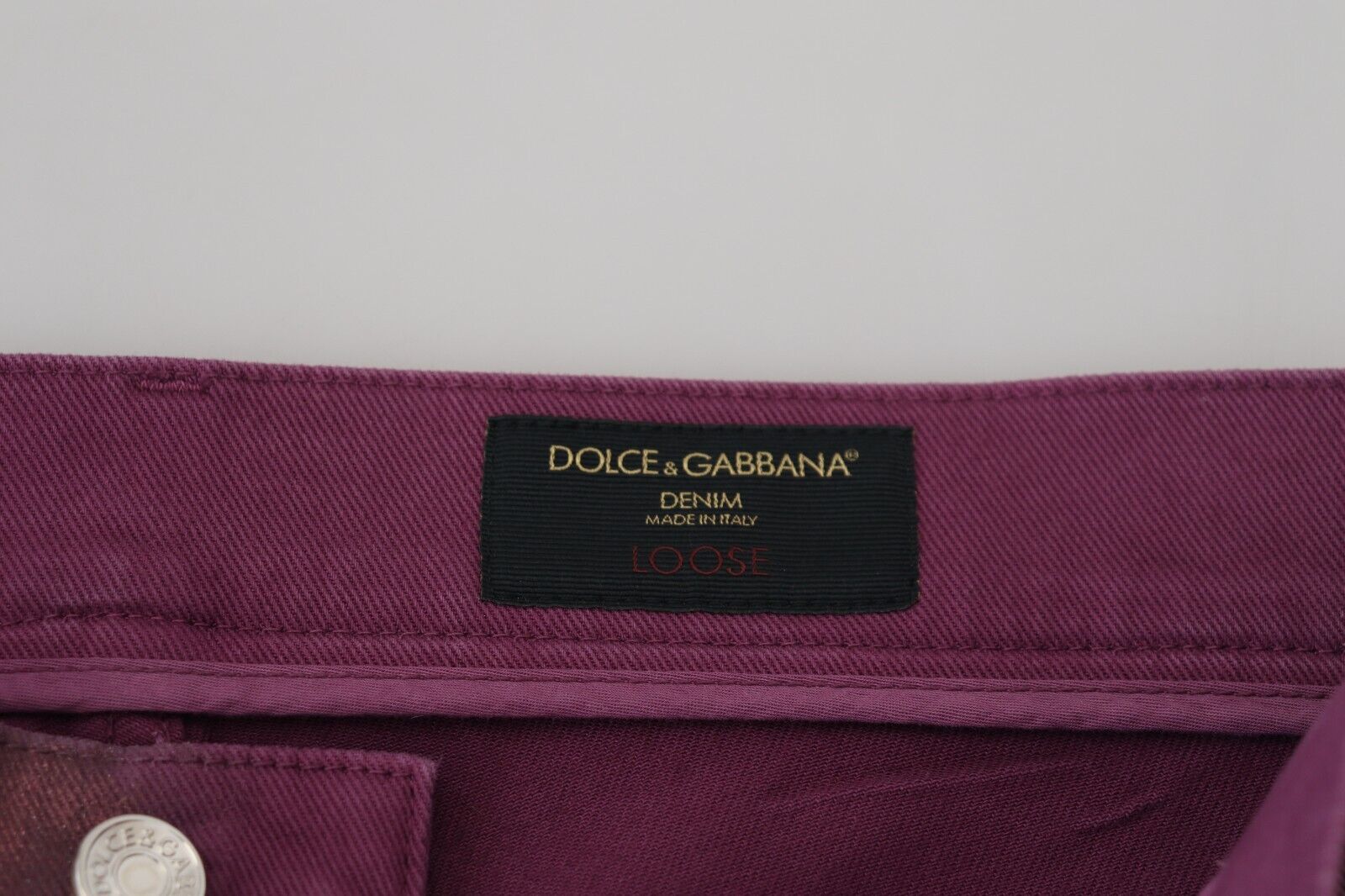 Purple fabric item with brand label