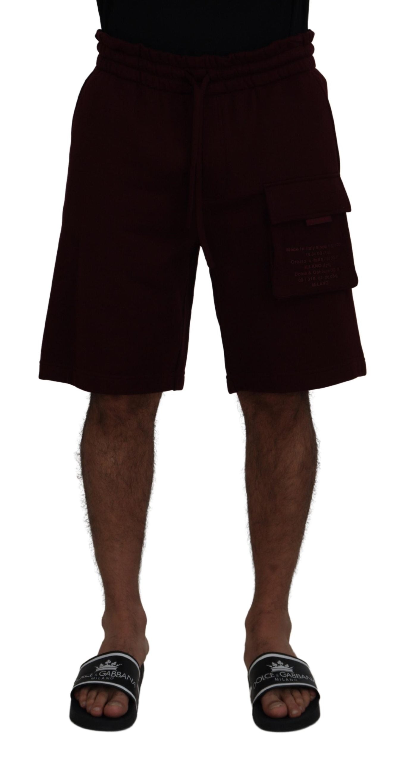 Man wearing black shorts and flip flops