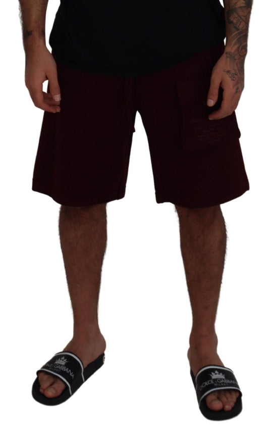 Man wearing black shirt and red shorts