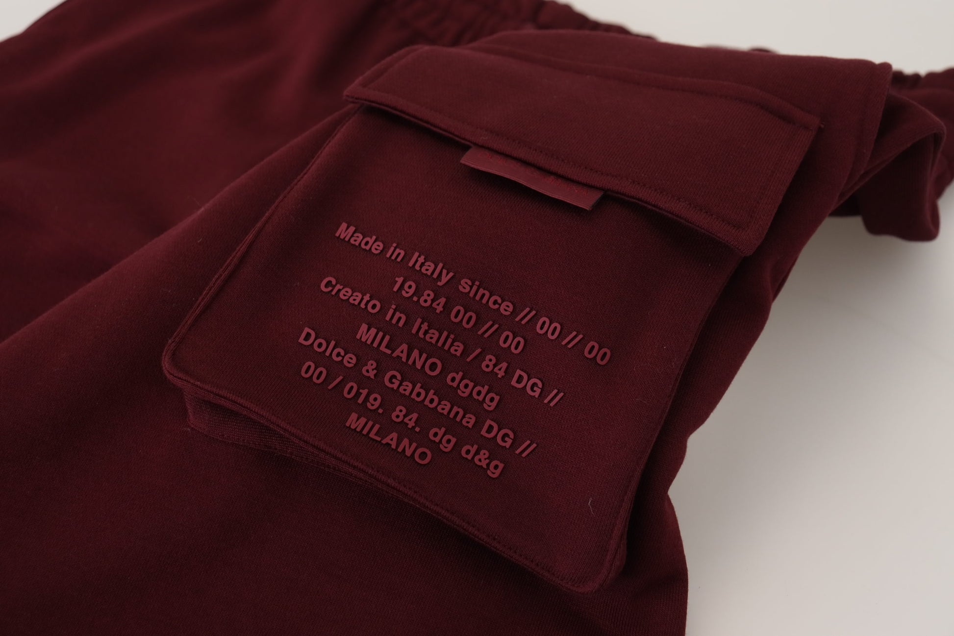 Red velvet pants with embroidered label