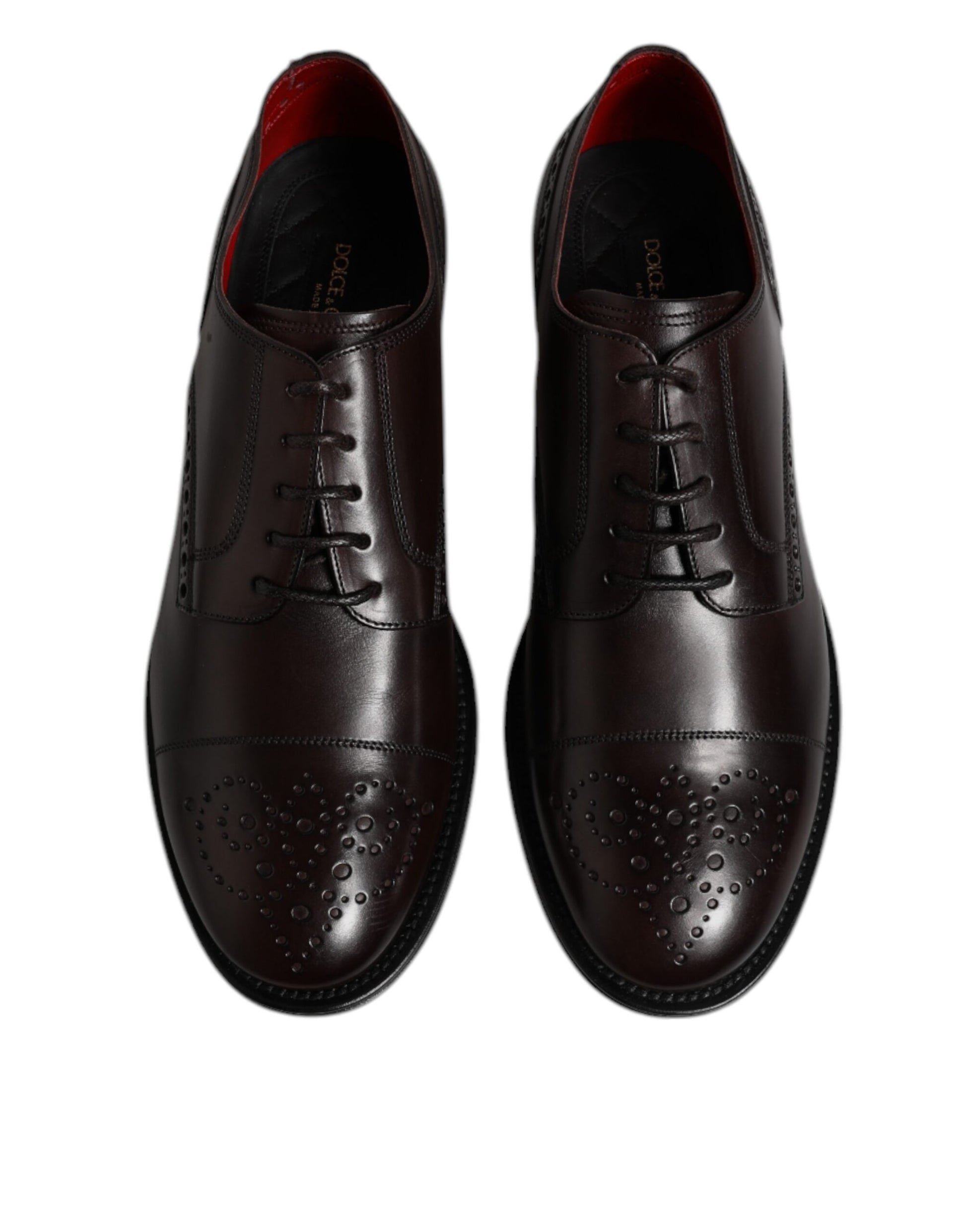 Pair of men's dress shoes, maroon calfskin leather, laced up with silver eyelets and tonal stitching