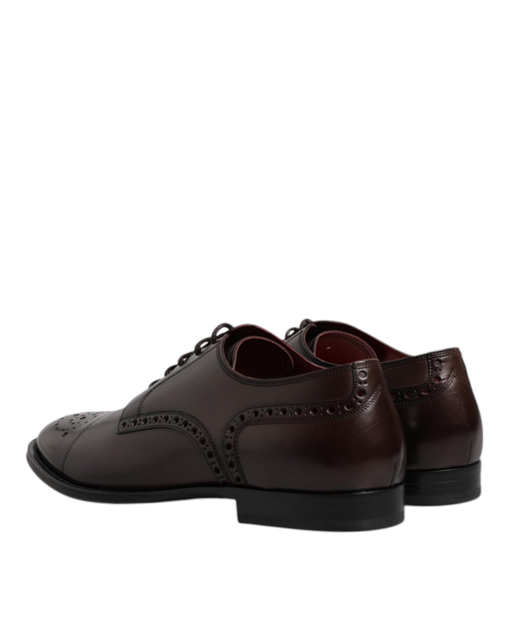 Pair of brown leather dress shoes with laces and a small heel