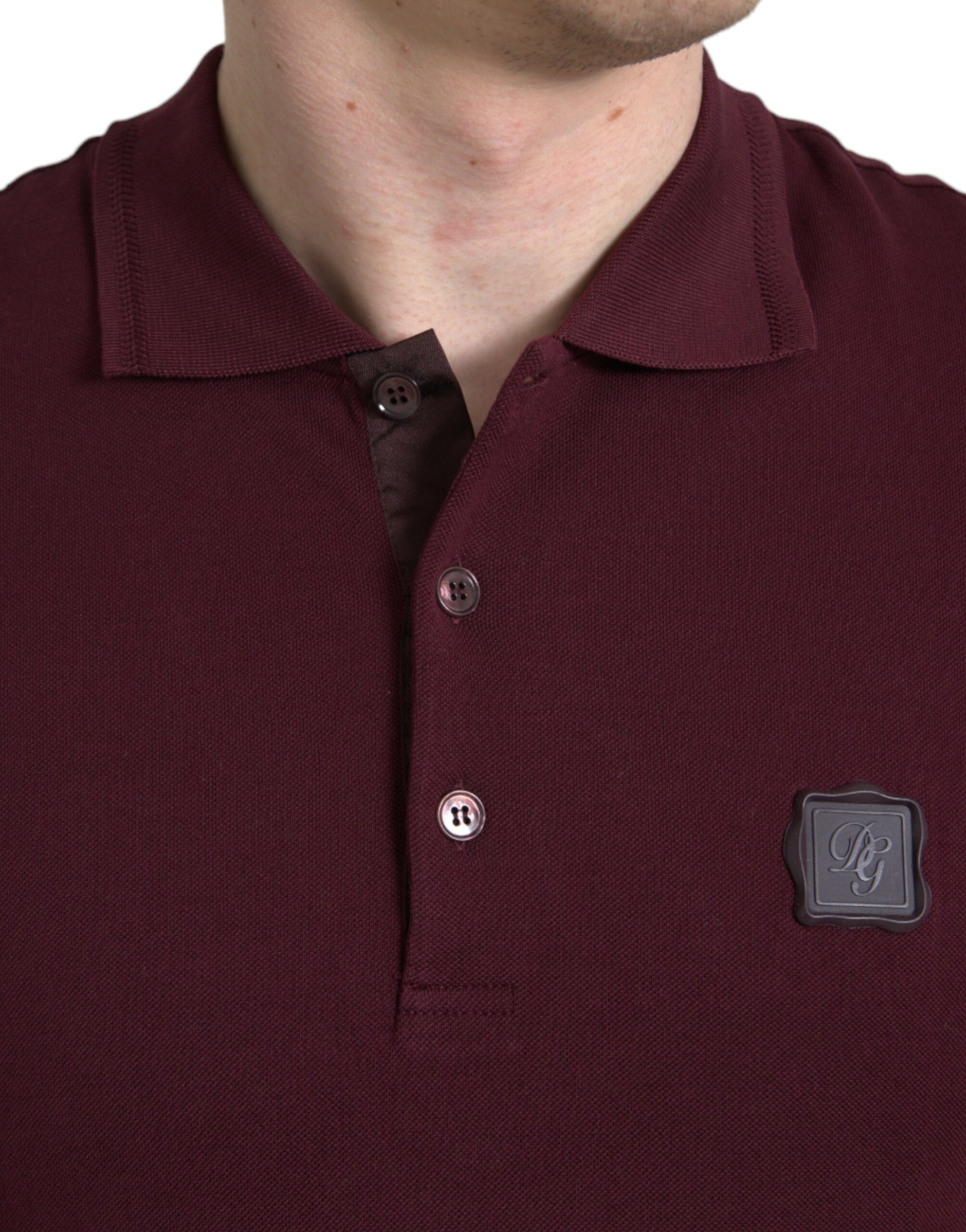 Man wearing polo shirt with logo on left chest
