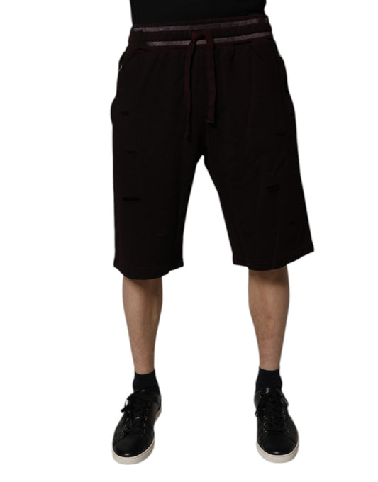 Man wearing black shorts and shoes