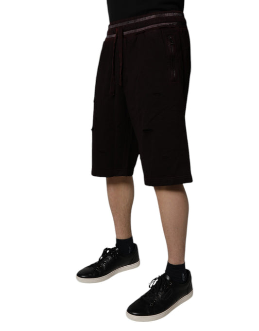 Man wearing black shorts and shoes
