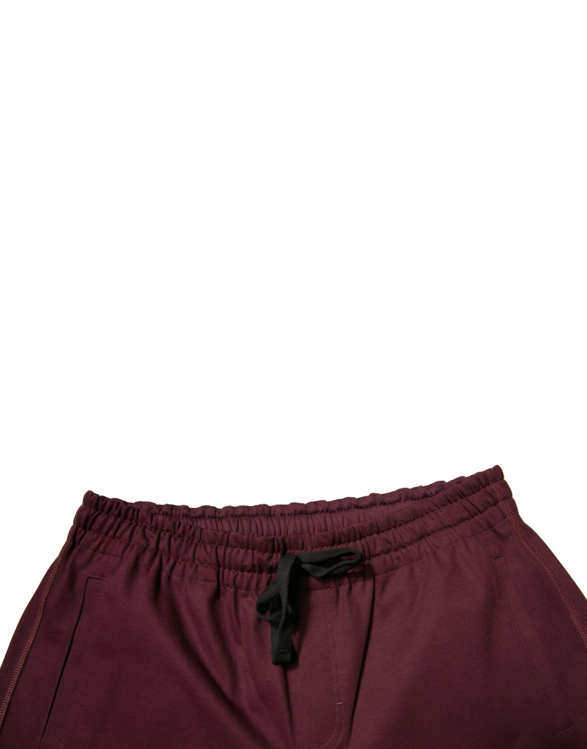 A pair of maroon cotton mid waist bermuda shorts with a black bow tie