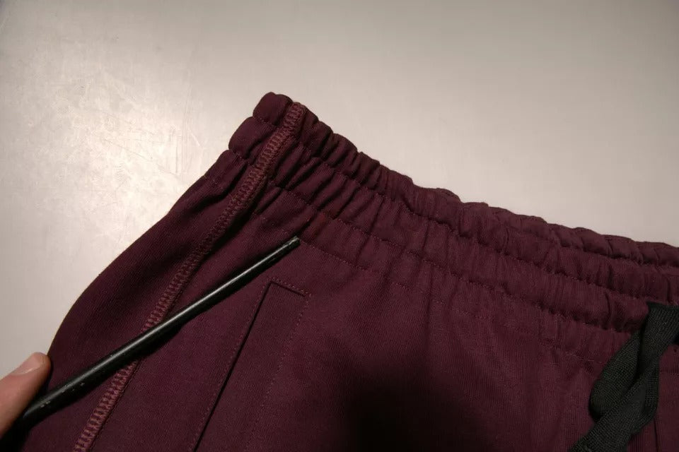 A pair of maroon cotton mid waist bermuda shorts with a black zipper