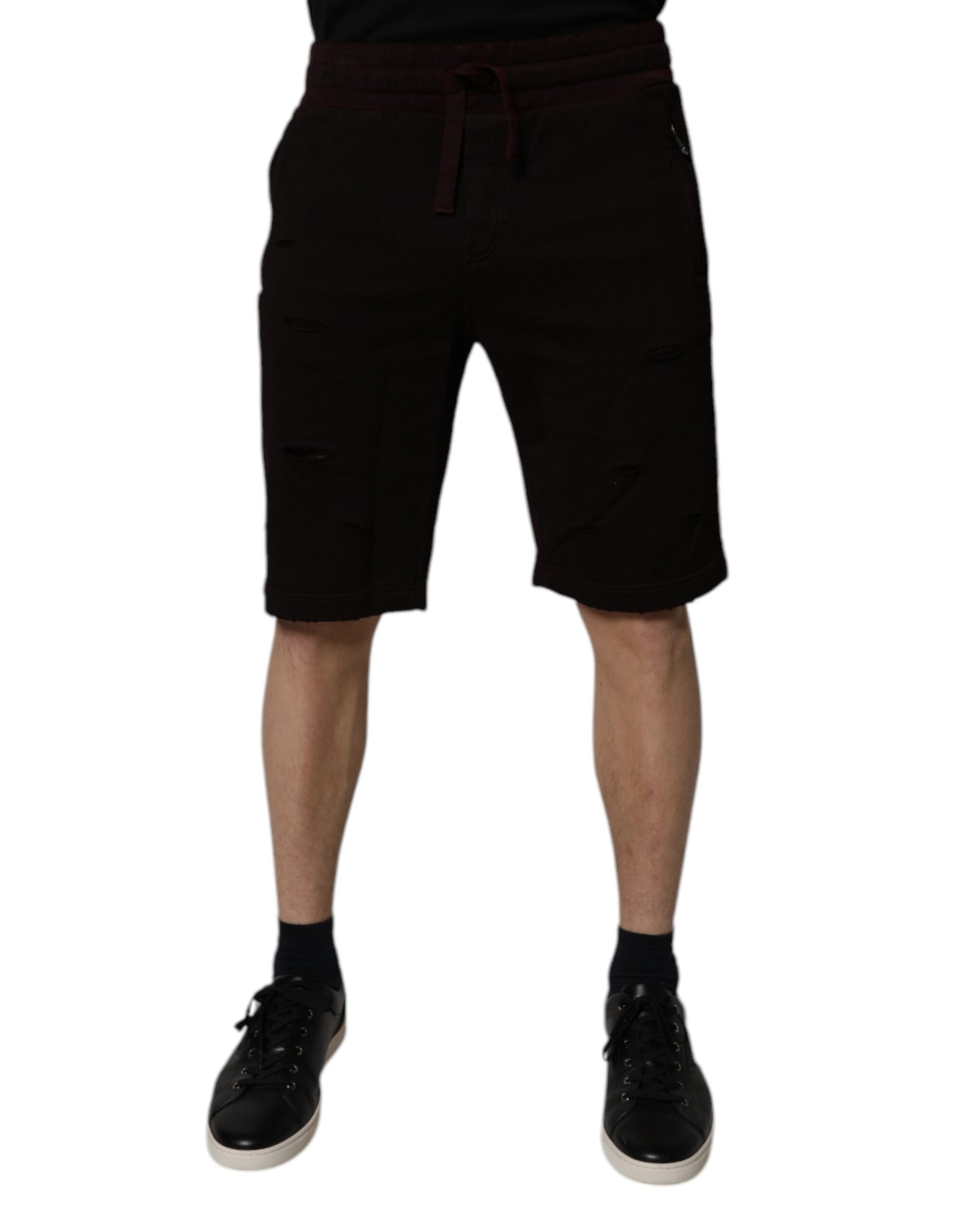 Man wearing black shorts and shoes