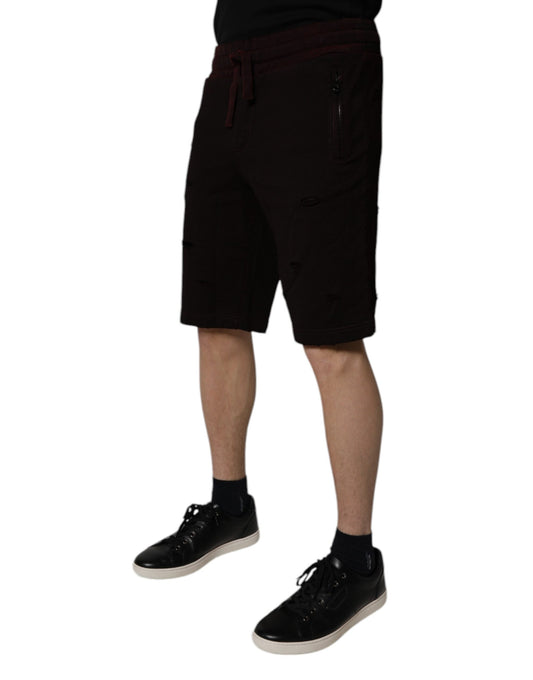 Man wearing black shorts and shoes