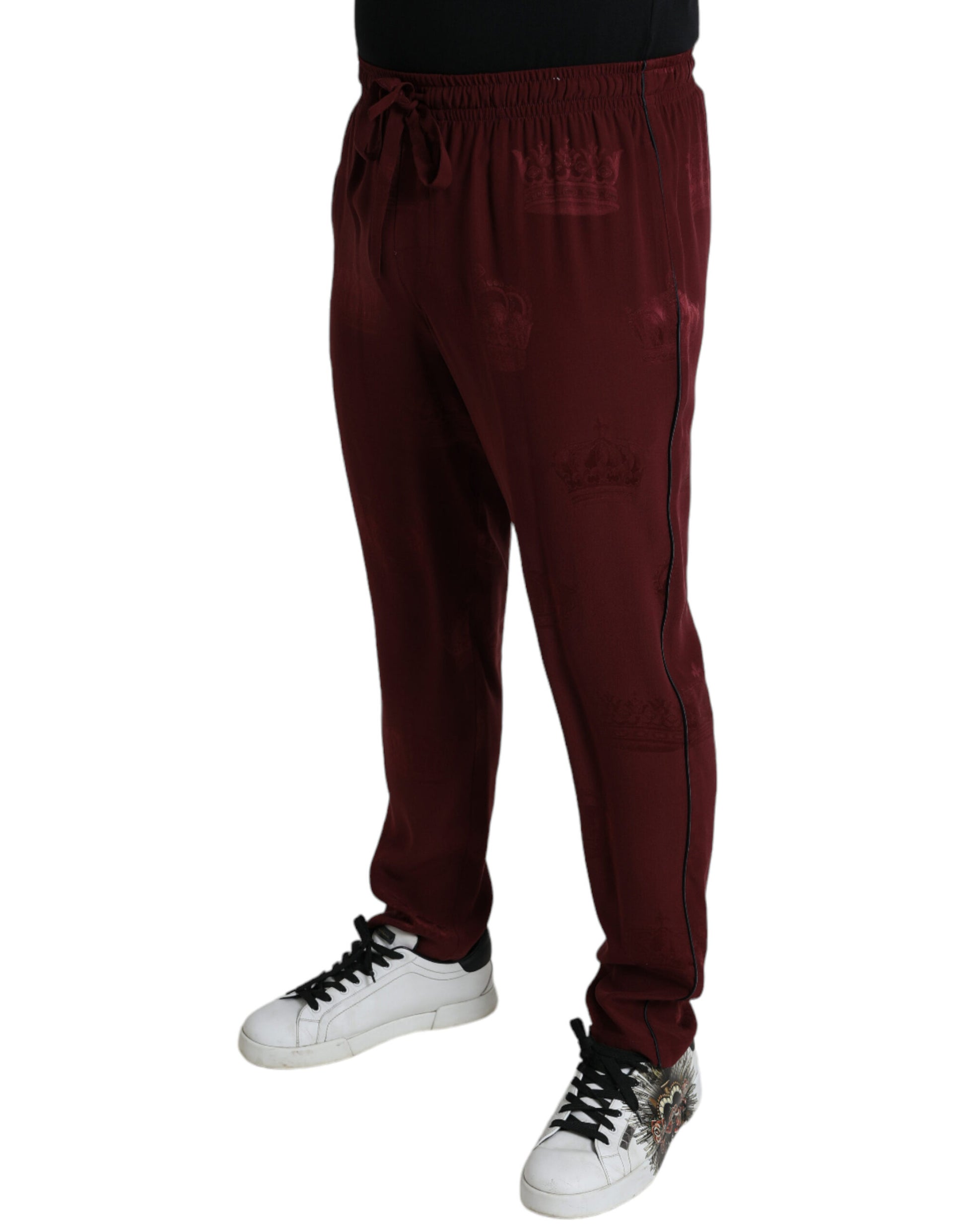 Man wearing red sweatpants and white sneakers