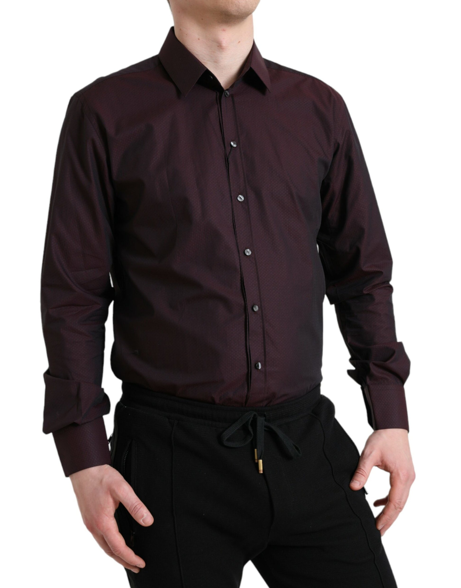 Man wearing a maroon shirt and black pants