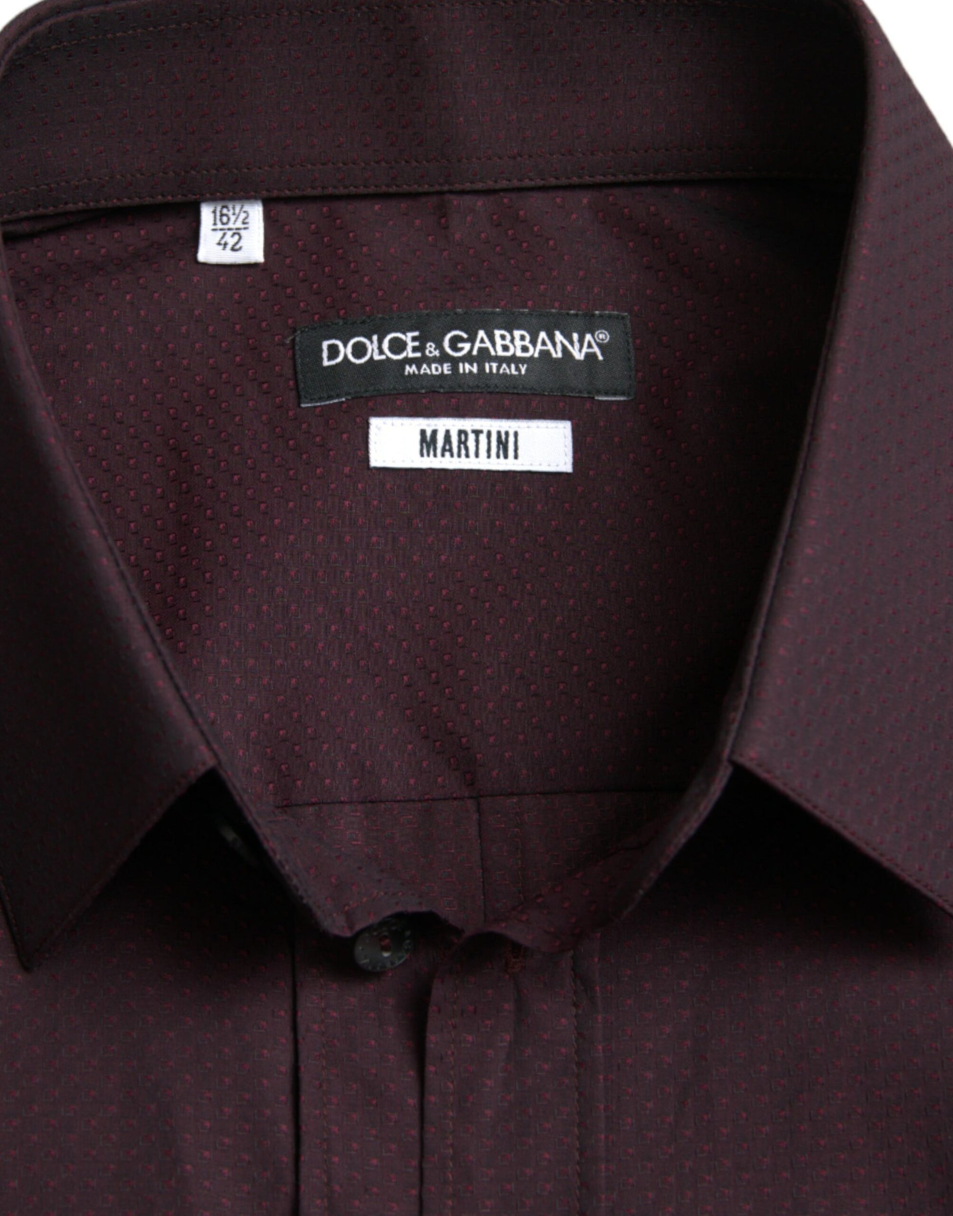 The shirt is maroon in color