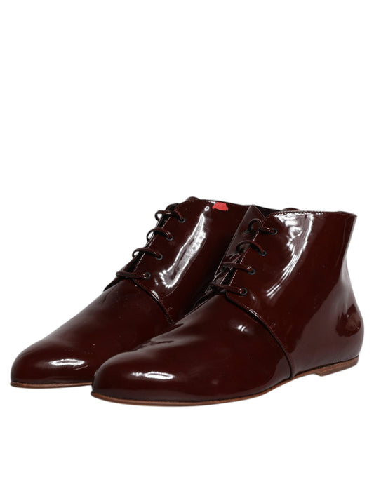 Pair of brown leather boots with laces