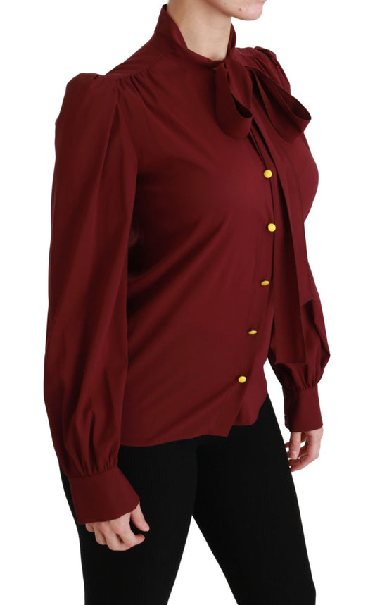 Woman wearing red shirt with ruffles on sleeves
