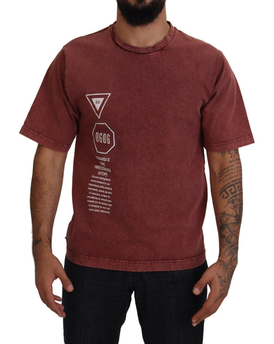 Man wearing maroon t-shirt with white graphic on front