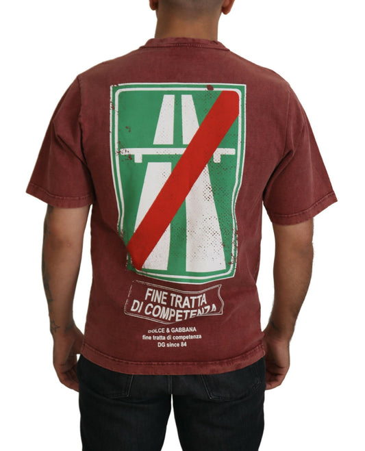 Man wearing red t-shirt with green and white logo