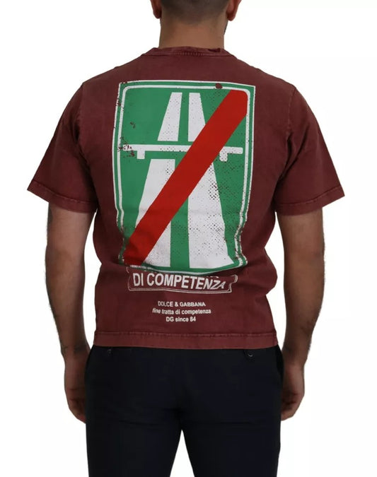 Man wearing red t-shirt with green and white logo on back