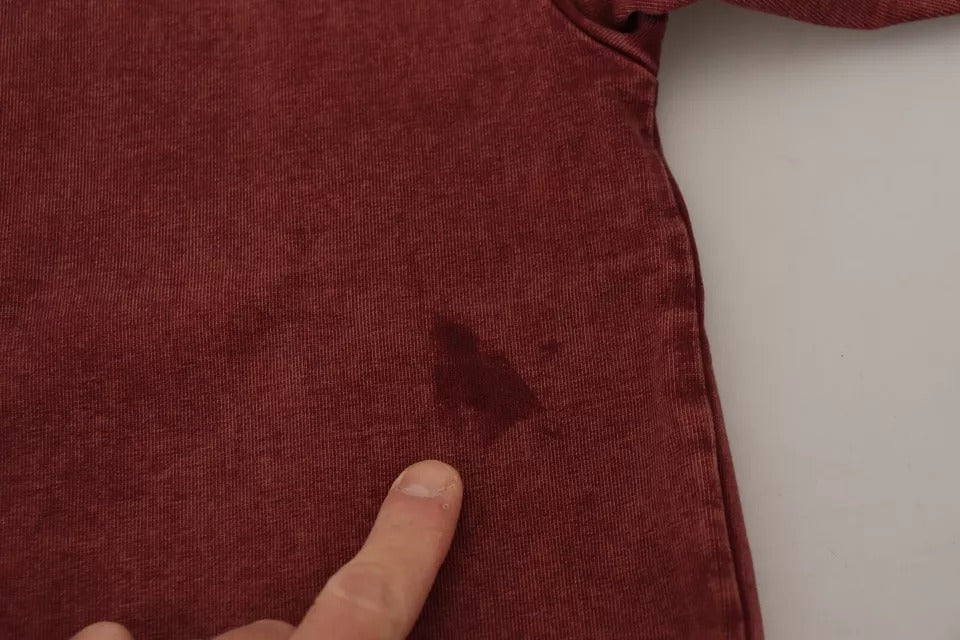 Red velvet fabric with a hole in it