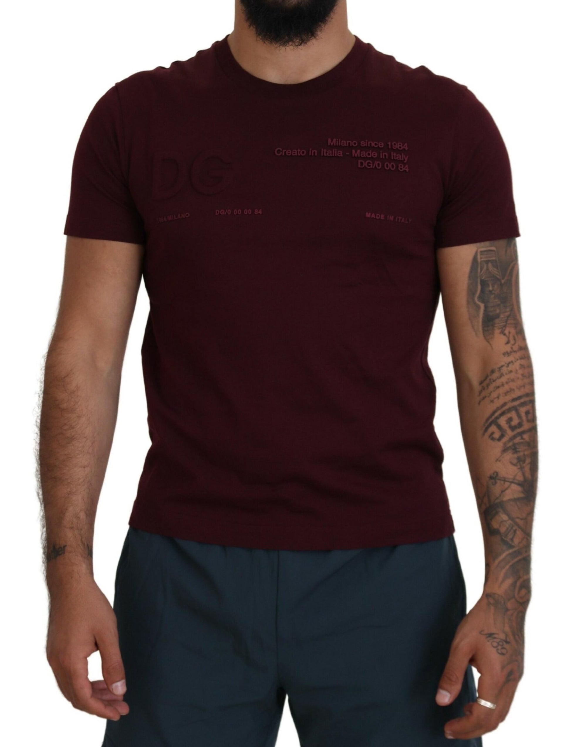 Man wearing maroon t-shirt with graphic design on front