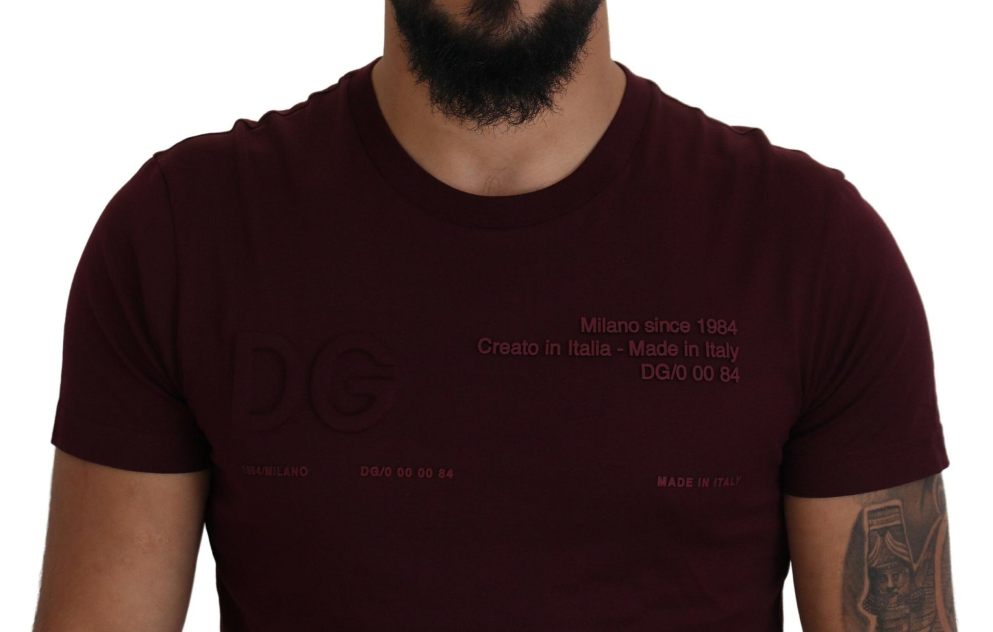 Man wearing maroon t-shirt with white lettering