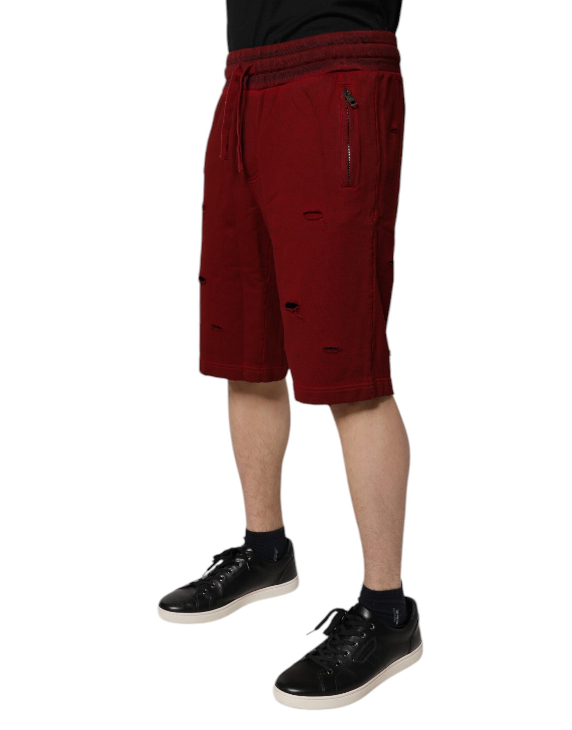 Red shorts with white stripes, branded by Dolce & Gabbana