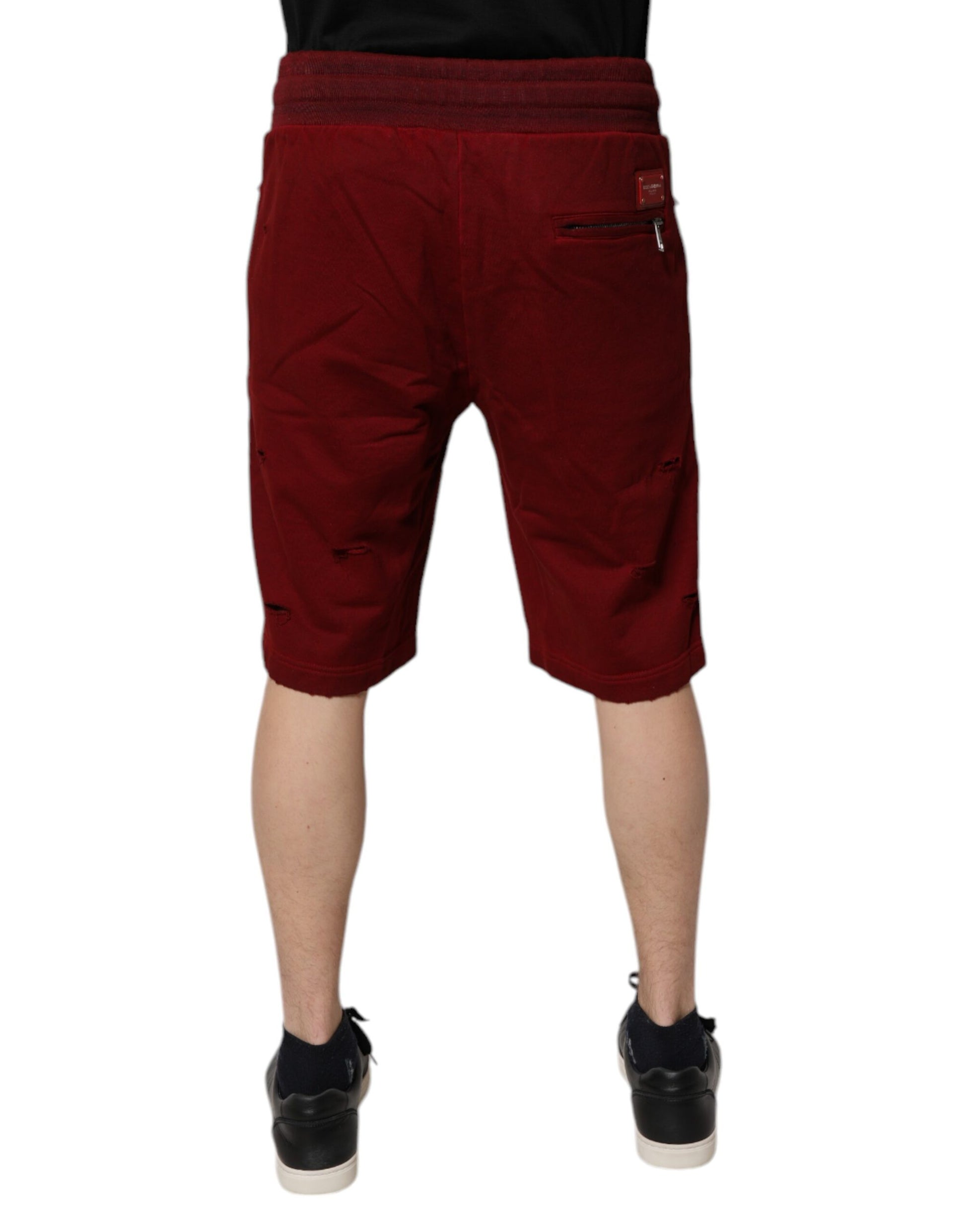 Red shorts with white stripes on sides, worn by mannequin