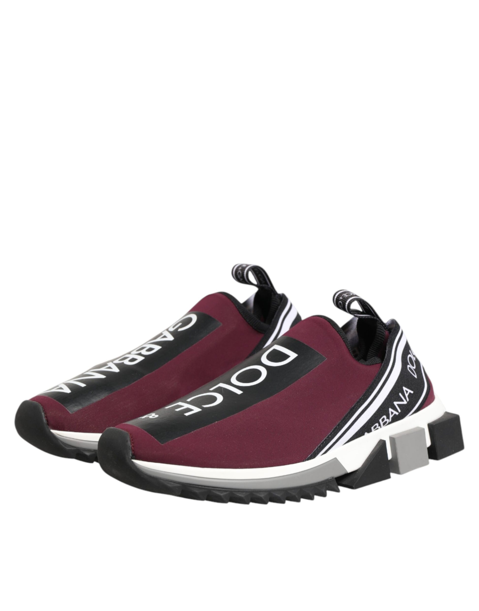 Pair of maroon sneakers with white laces and a black logo on the side