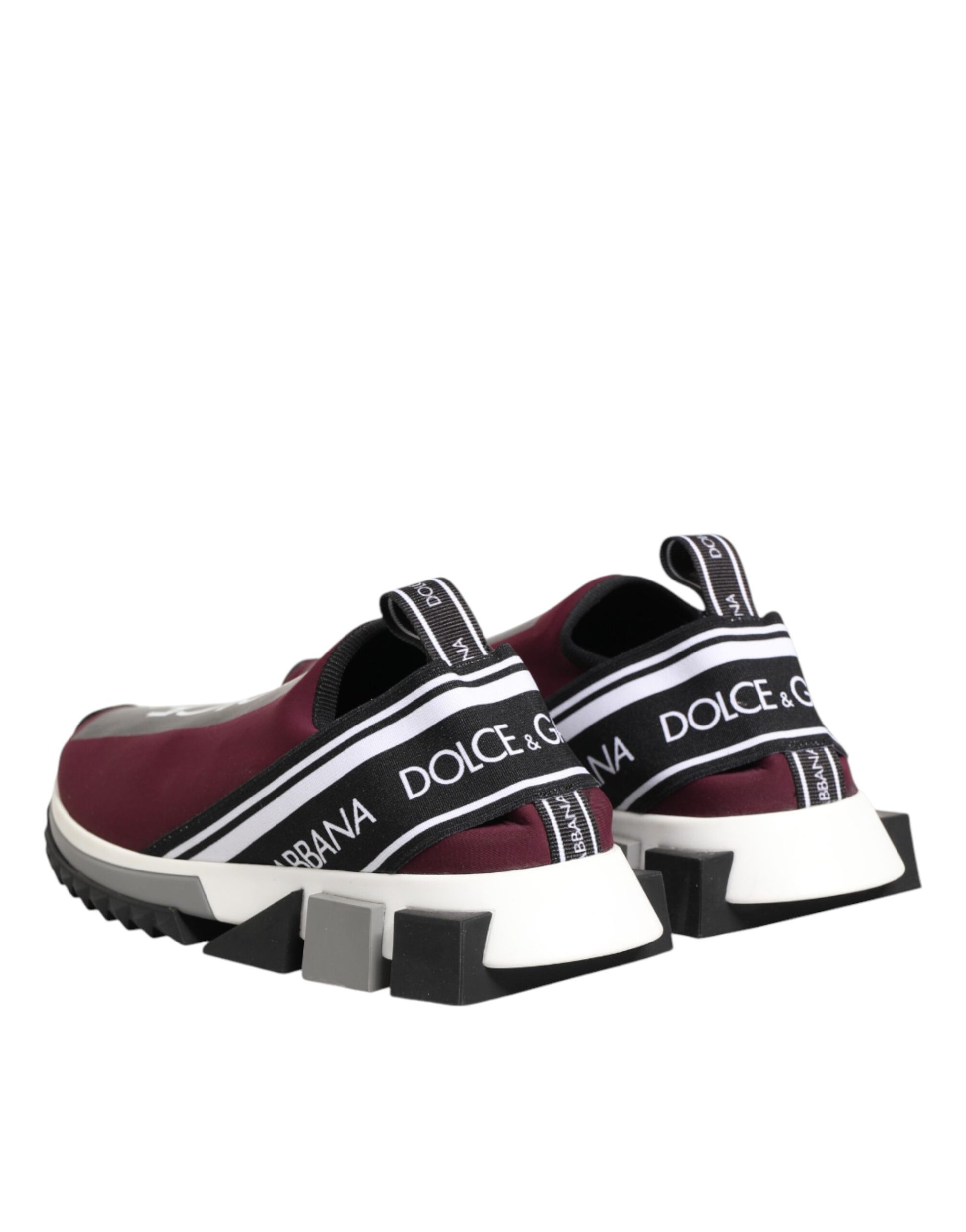 Pair of maroon sneakers with white soles and black laces