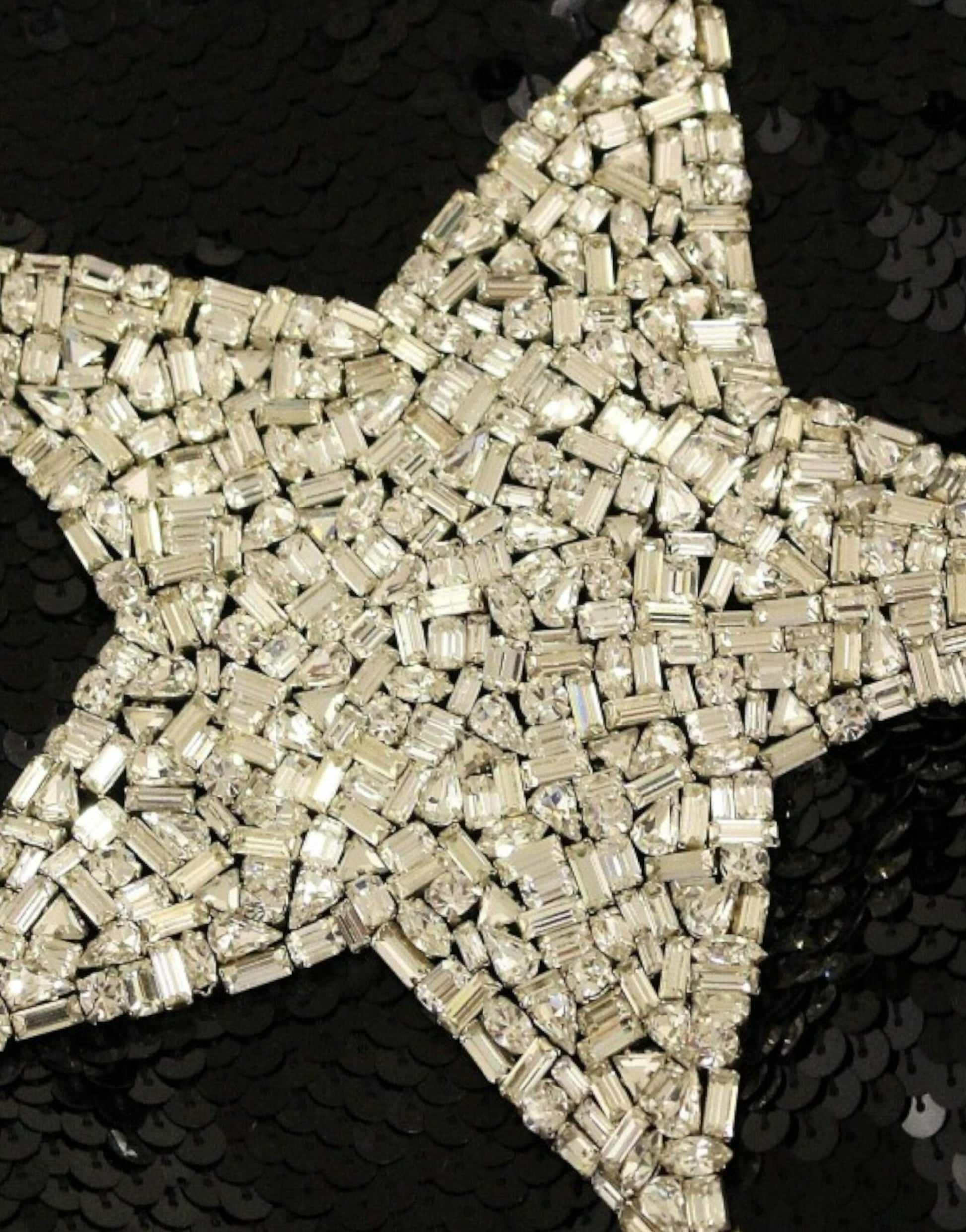Shiny star decoration made from small metal pieces
