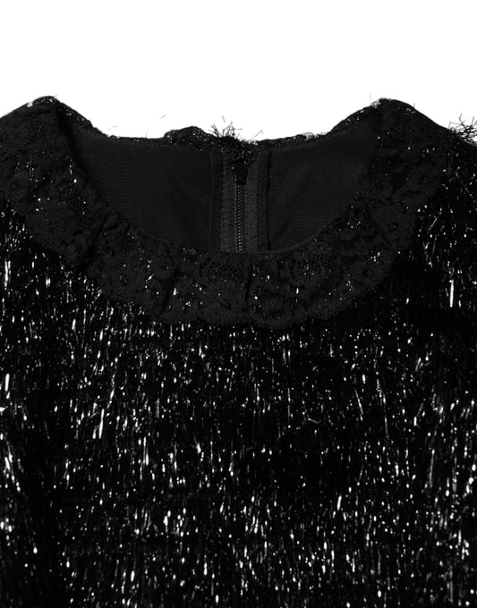 A black dress with metallic sparkles, featuring an A-line silhouette and midi length. It is made of polyester