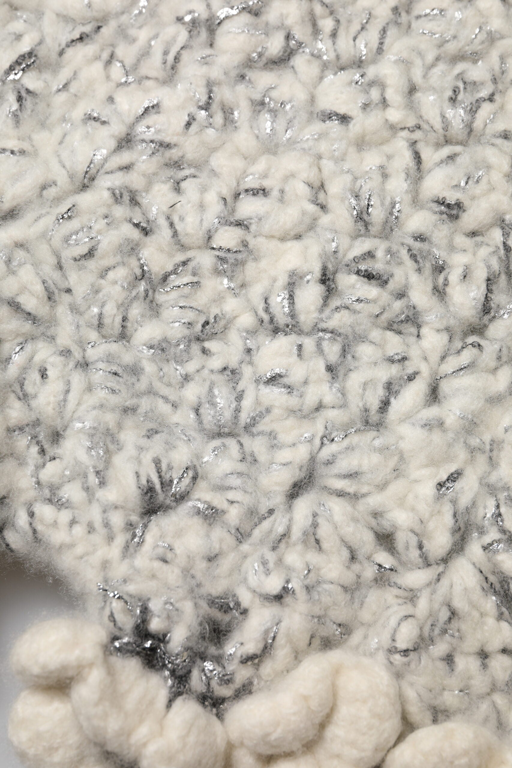 Handmade crocheted blanket with fringe detailing